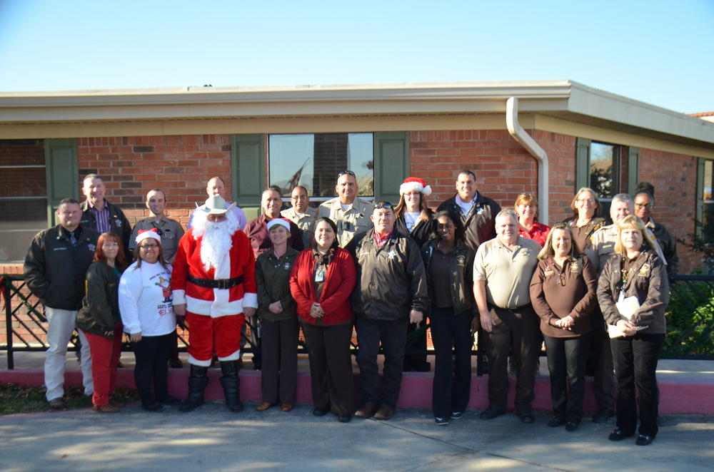 Sheriff's office staff photo for their annual Santa Sheriff event